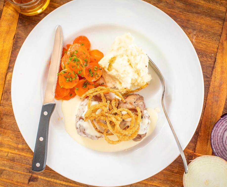 The Majestic Grille’s Grilled Pork Tenderloin, one of the must-try dishes in Memphis