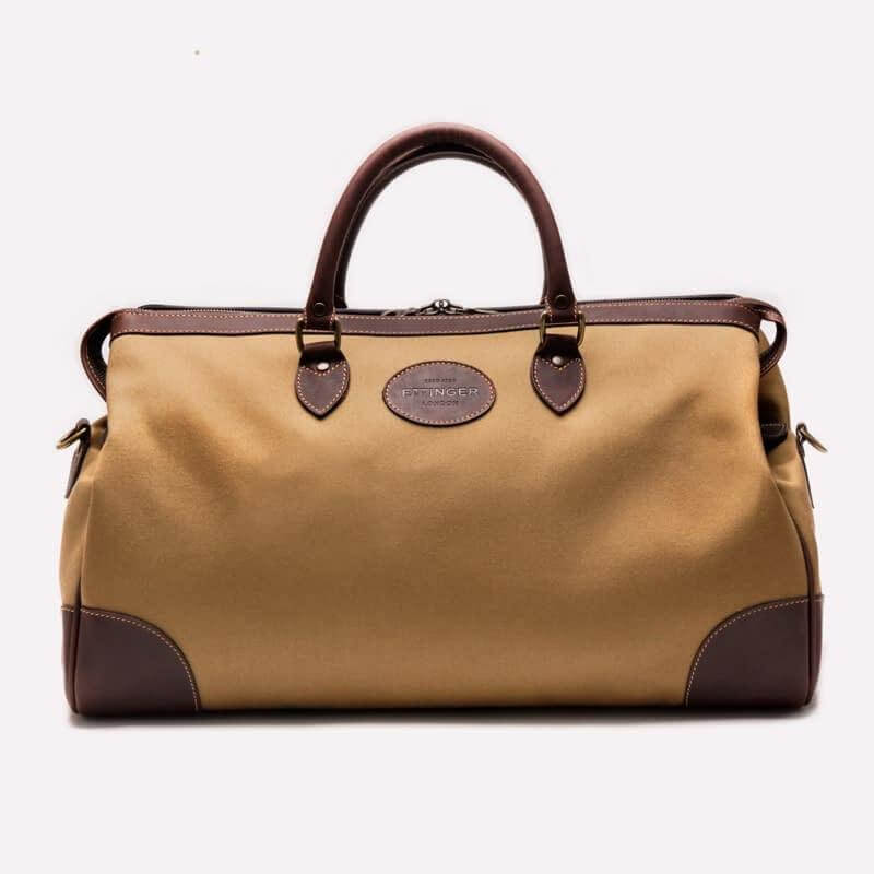 Men's weekender bag, $790, from The Oxford Shop | Image: The Oxford Shop Men's leather and canvas weekender bag in brown