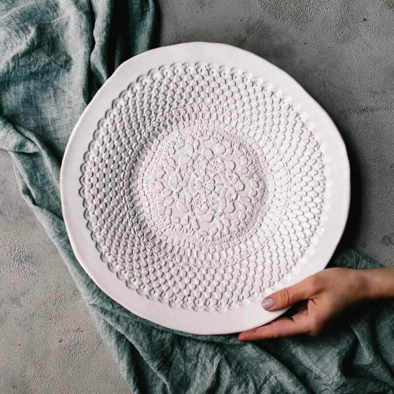 Serving platter, $116, from SB Shop Detailed white circular platter from Handmade Studios TN