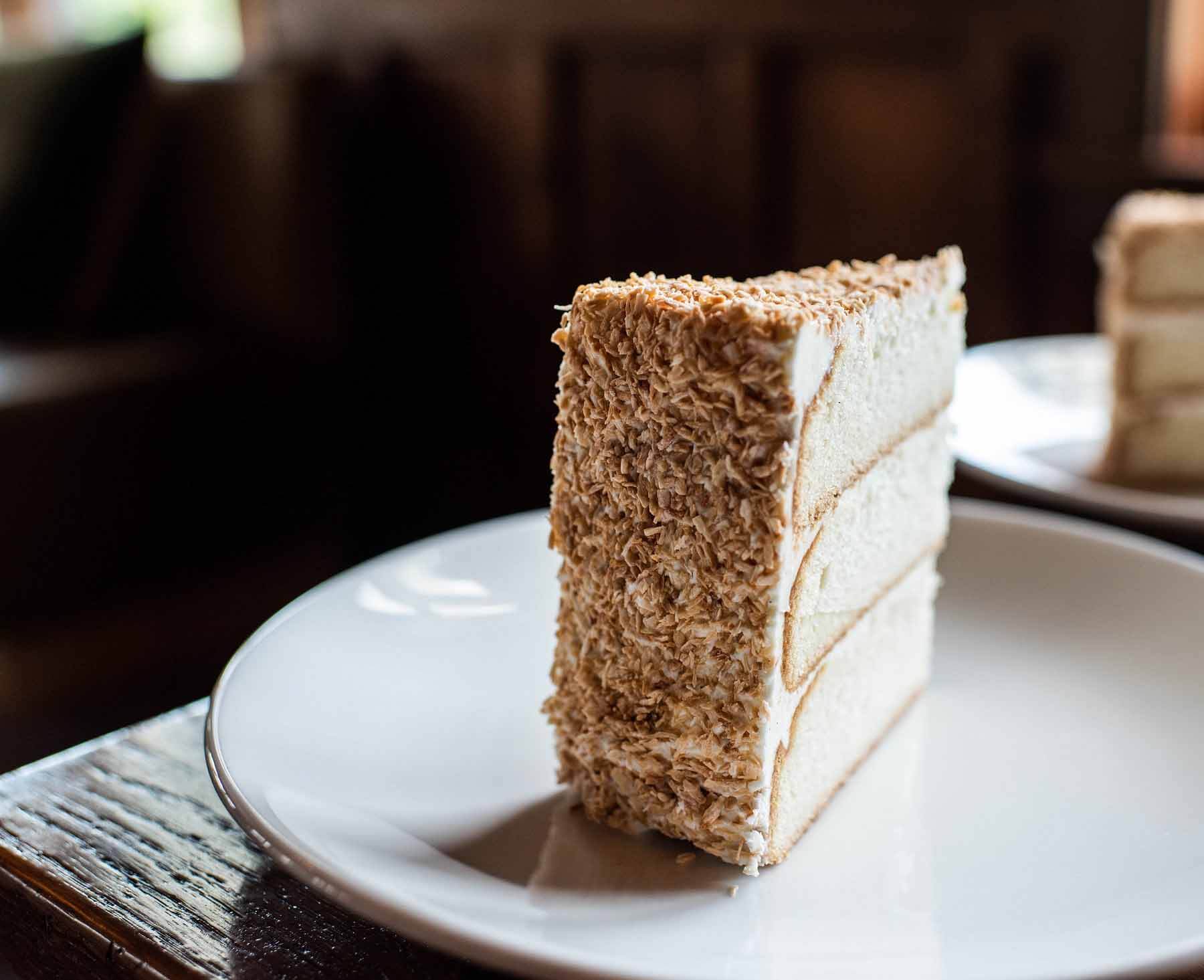 Pastry chef April Franqueza is willing to bend the rules about local ingredients for this marvelous coconut cake, and you should too! Image: High Hampton Coconut cake from The Dining Room at High Hampton