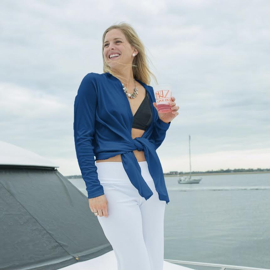 Cover-up, $148, at SB Shop Woman on boat wearing a ZAGS Coolin' It Cardi Cover-up