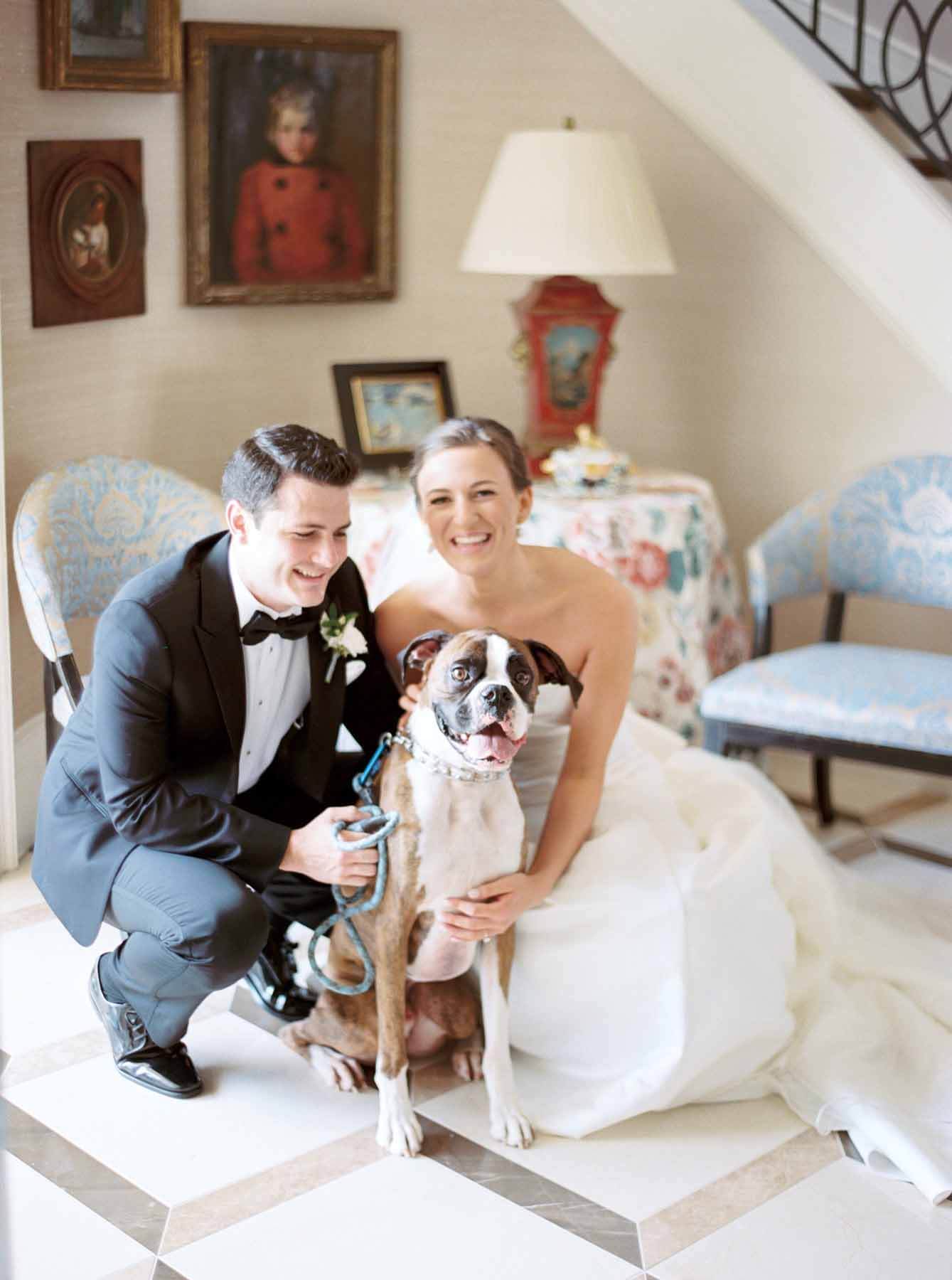 The bride and groom with their Boxer, Zeke