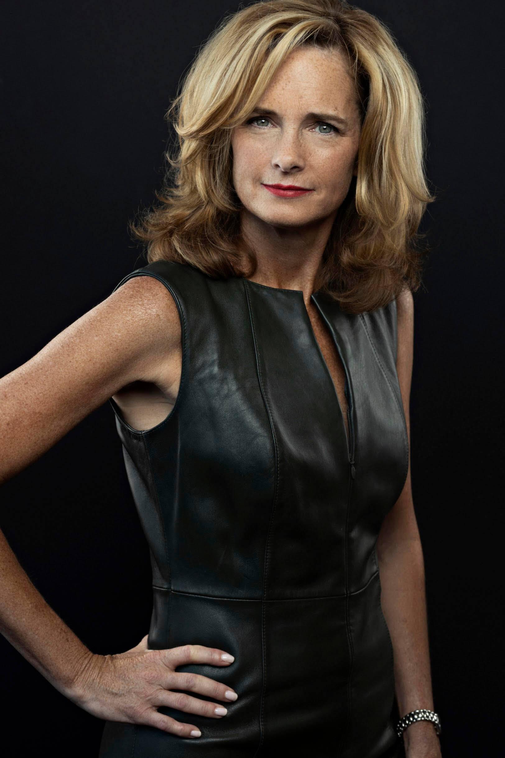 Laura Tunnicliffe of Now Leasing in a black leather dress