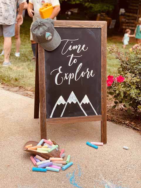 "Time to Explore" chalkboard sign
