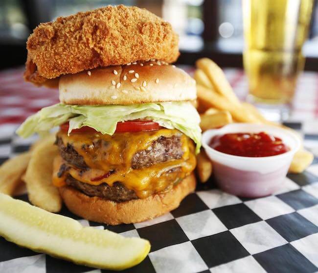 Craving a burger from Huey's? Image Facebook: Burger with onion ring