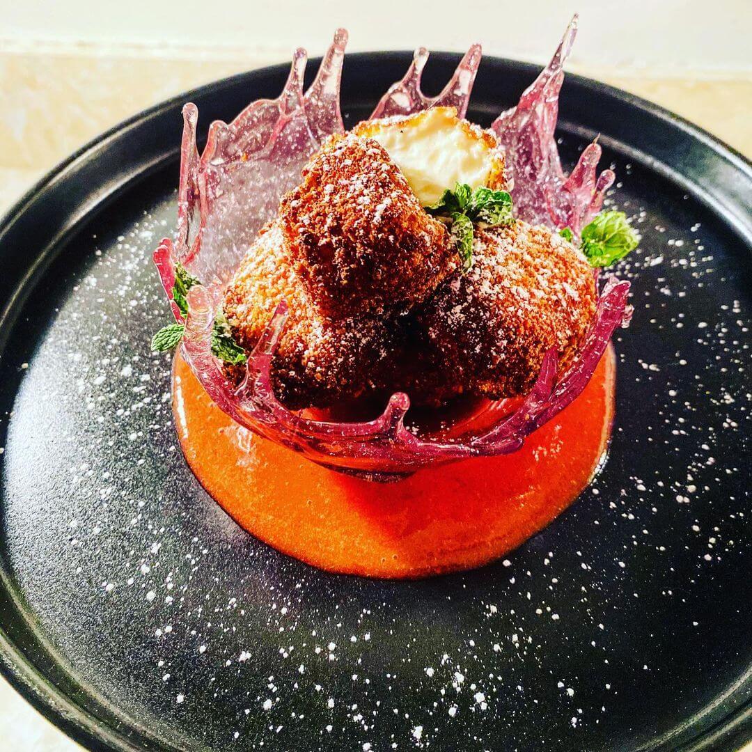 Cheesecake served in an edible glass bowl from Phantom Café Modern Eatery & Catering Co., a new Louisville restaurant