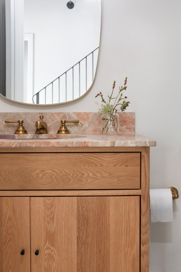 Close-up of the powder bath vanity and pink marble countertops.