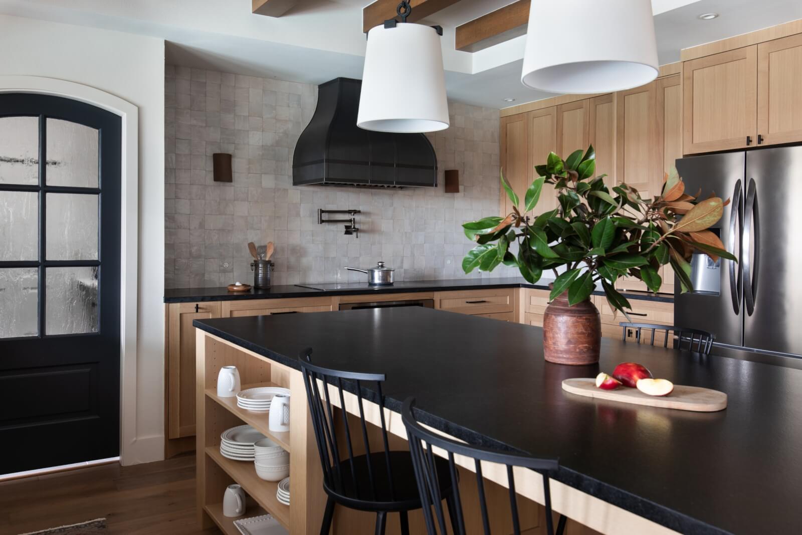View of an Austin Hill Country kitchen with black granite countertops