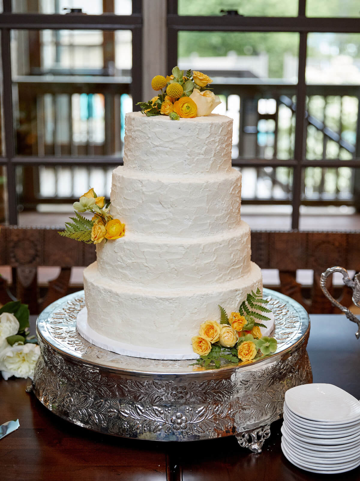 The four-tiered white cake at a Highlands wedding