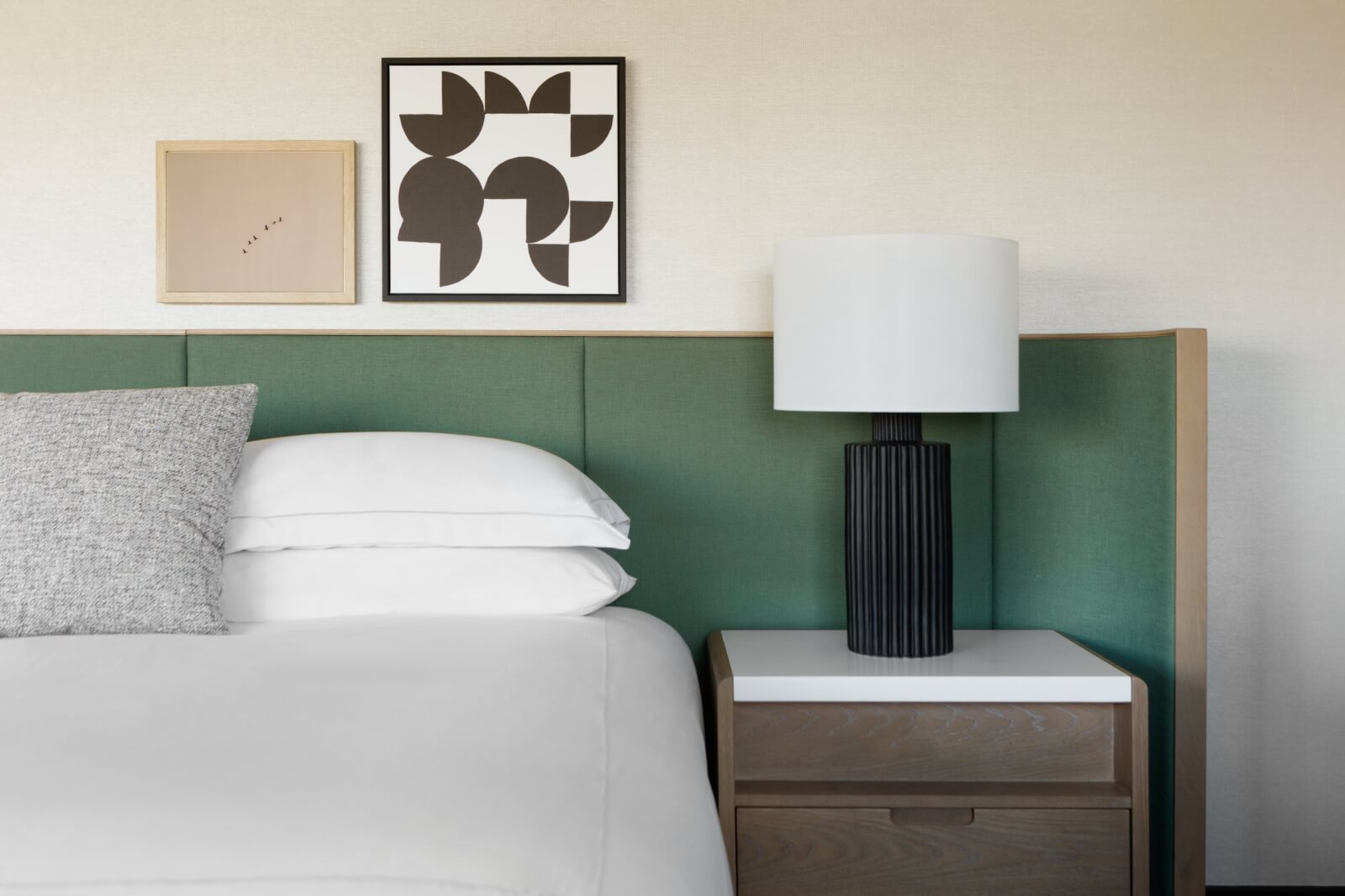 Close-up of bed and nightstand at boutique hotel