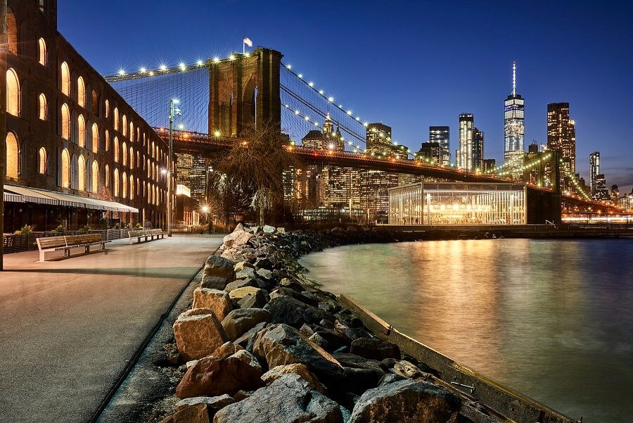 View of NYC skyline at sunset from Brooklyn Bridge Park