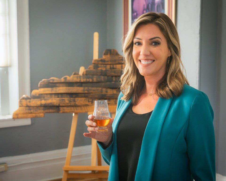 Jennifer Cissell holding bourbon in Kentucky Bourbon Festival glass