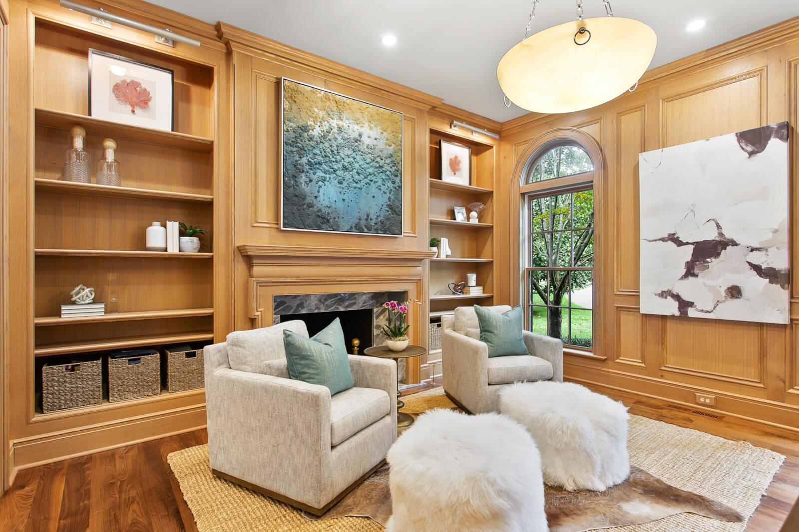 Home office with wood paneled walls