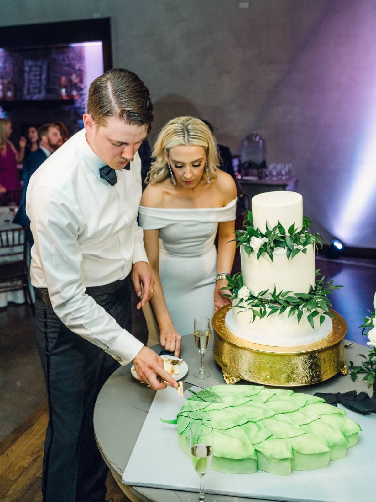 Whitley and Beau cut the groom's cake.