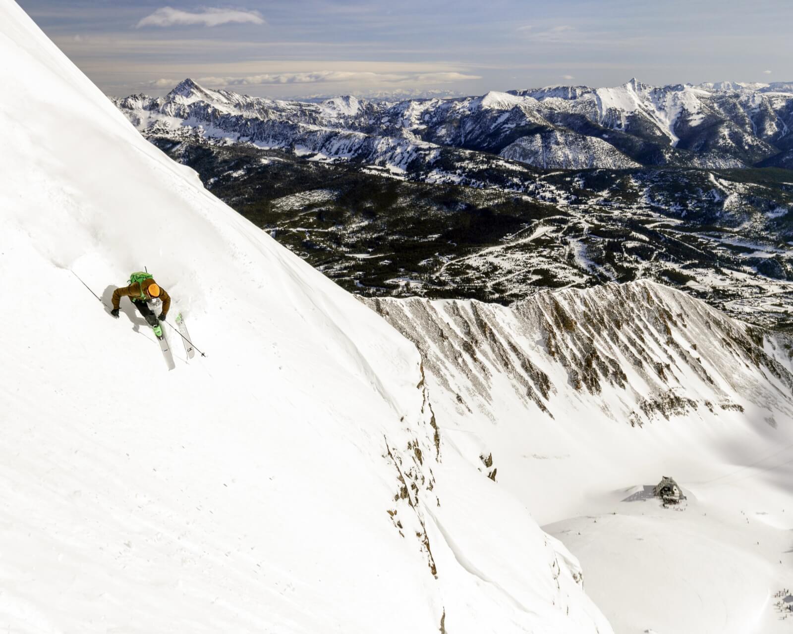 Man downhill skiing on snowy mountain