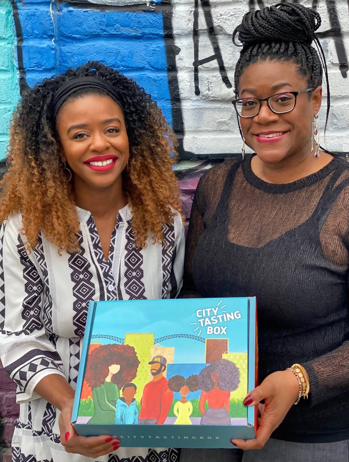 Cristina McCarter & Lisa Brown holding a City Tasting Box