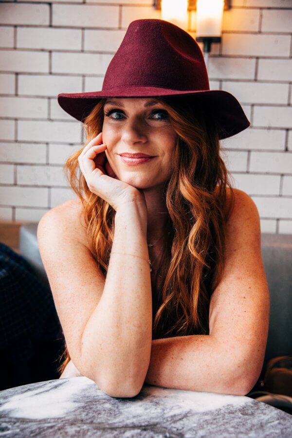 AJ Vaden in a burgundy hat
