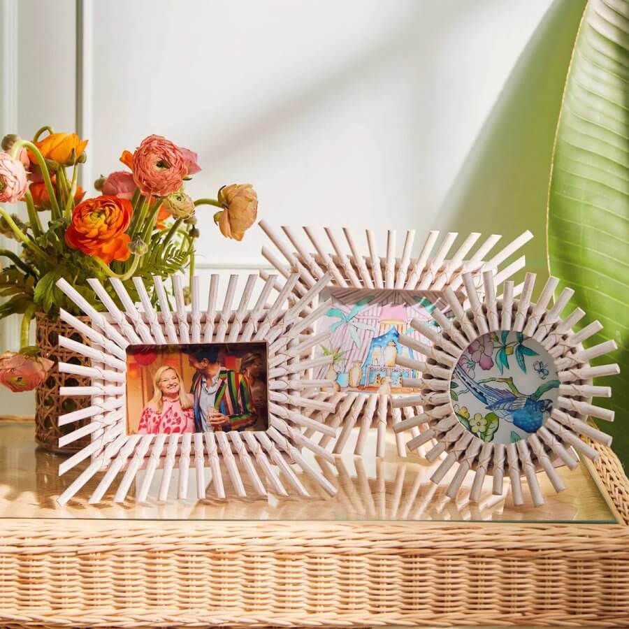 three white rattan picture frames