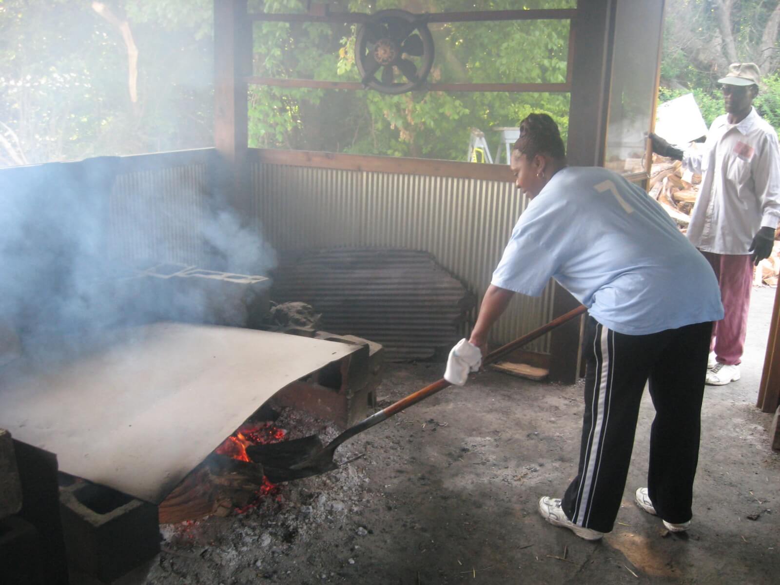 Helen Turner at Helen's Bar-B-Q, stoking the fire.