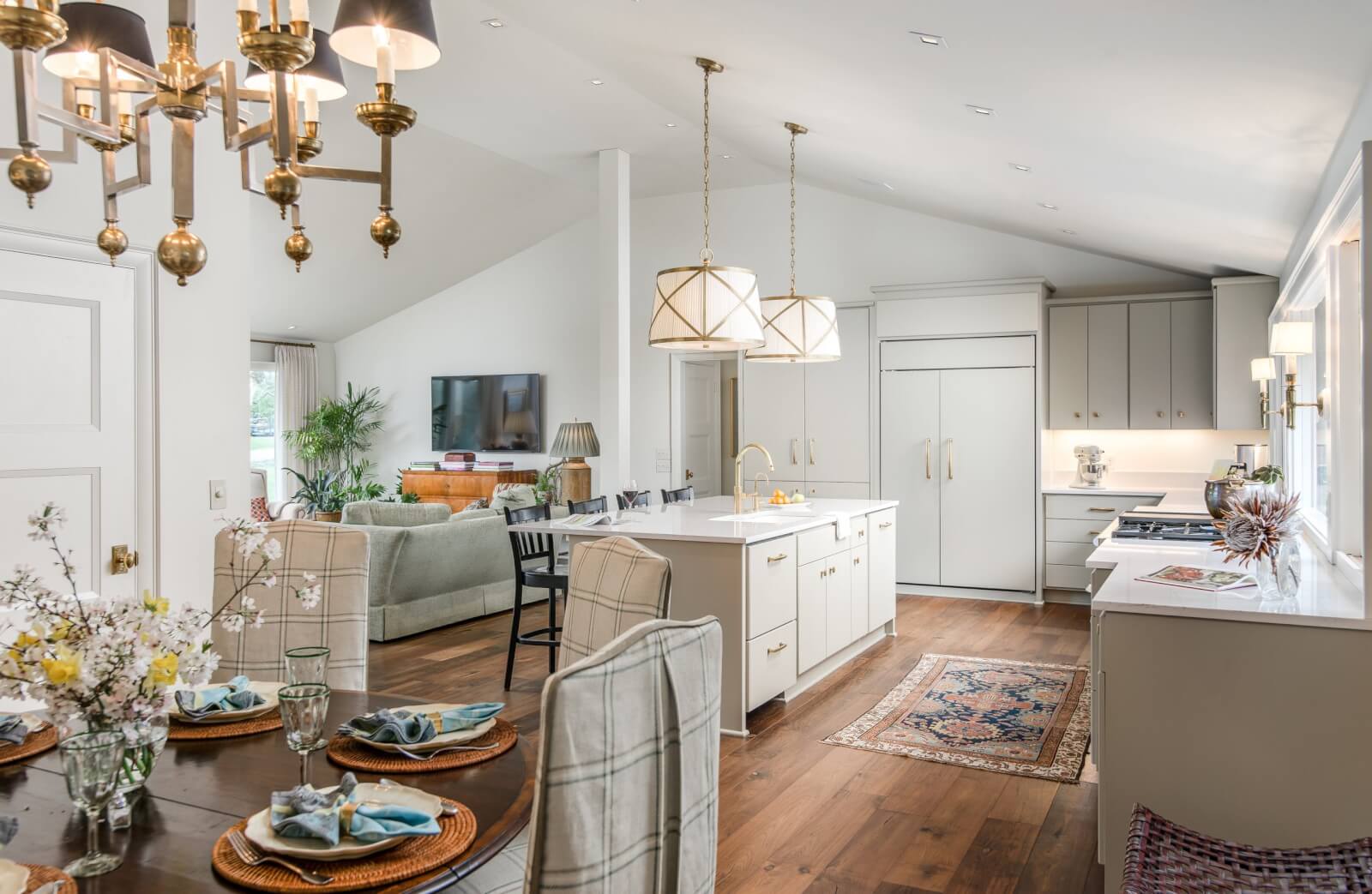 Kitchen after a remodel, complete with dining room, center islands, and cabinetry.