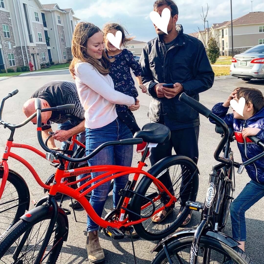 Family receiving bicycle donations from Tennessee Resettlement Aid