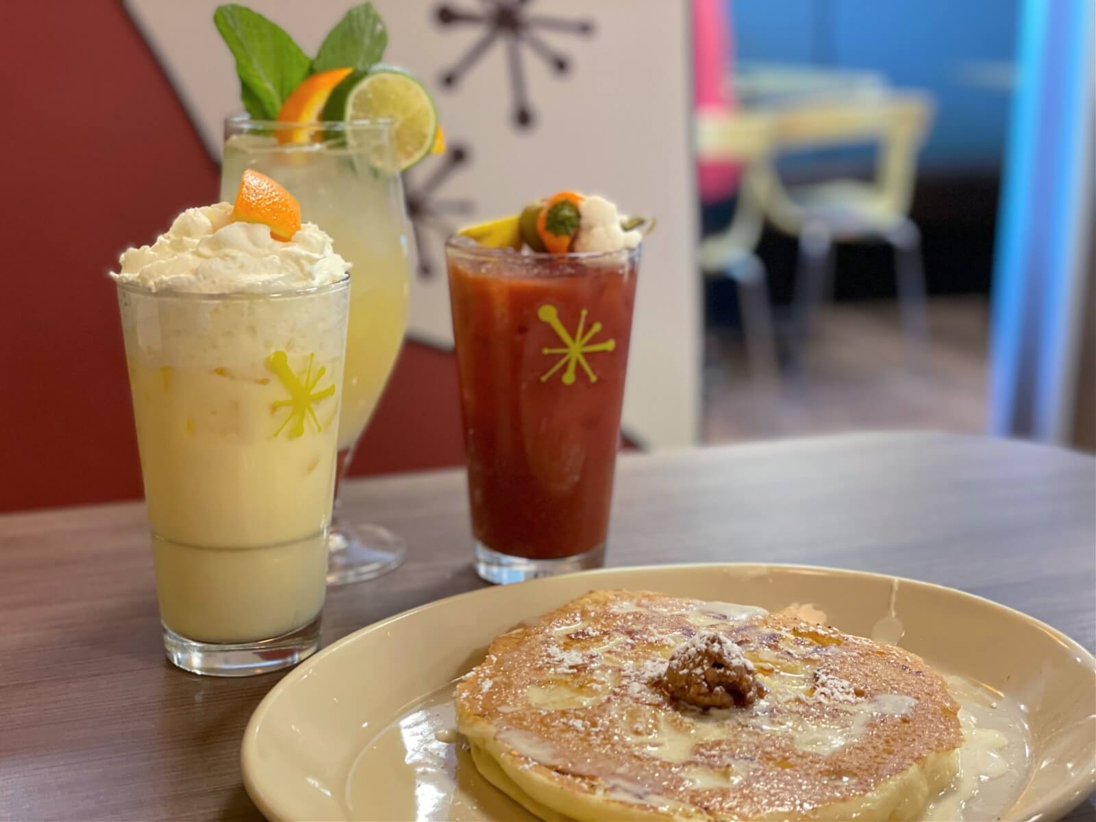 Thanks to a delicious wake-up call from Snooze, mornings just got even better! Image: Jenna Bratcher A trio of morning cocktails with pineapple upside down pancakes.