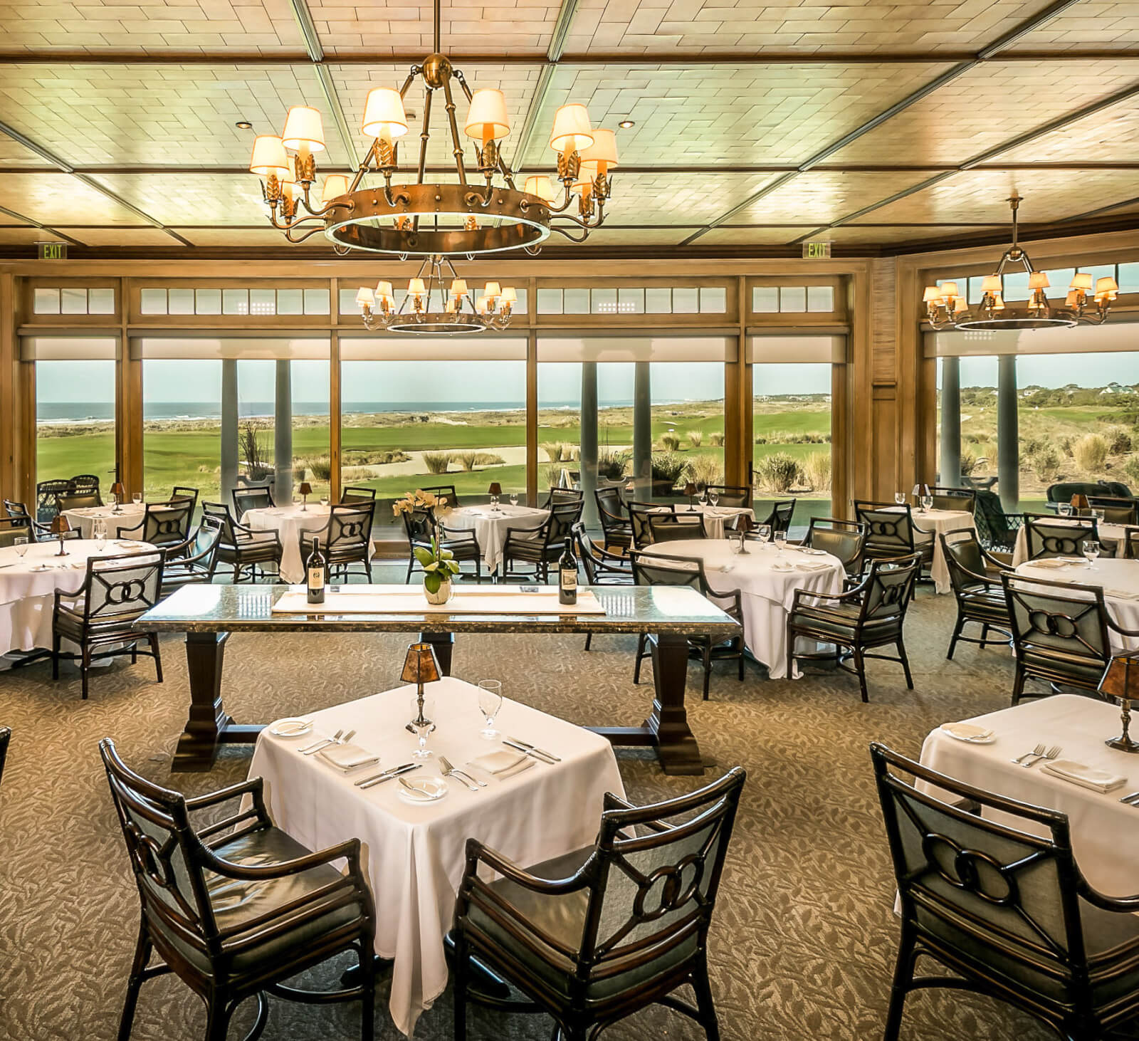 Tables overlooking the Ocean Course at the Atlantic Room restaurant