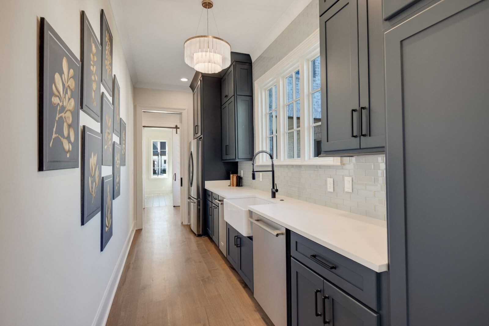 Scullery with dark cabinets and hardware