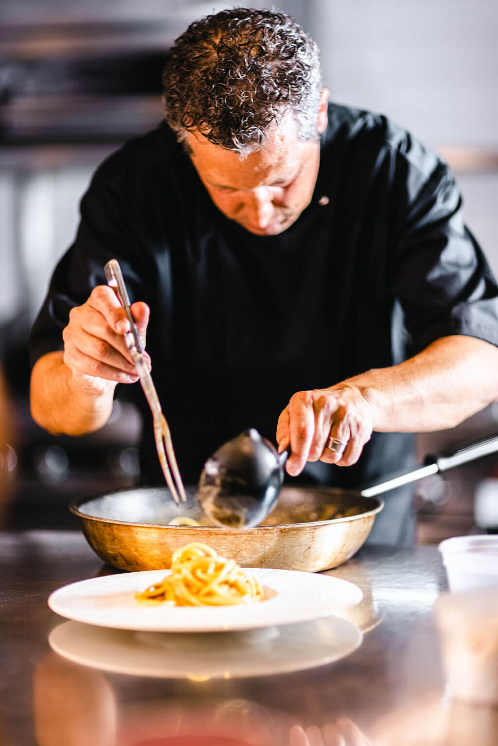 Chef Luigi Iannuario making a dish