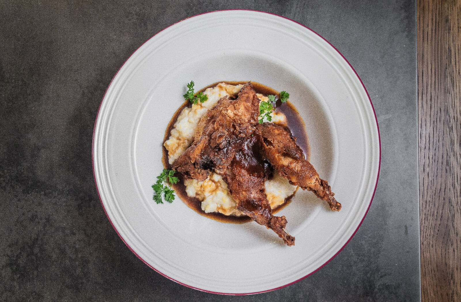 Chicken-fried quail over grits 