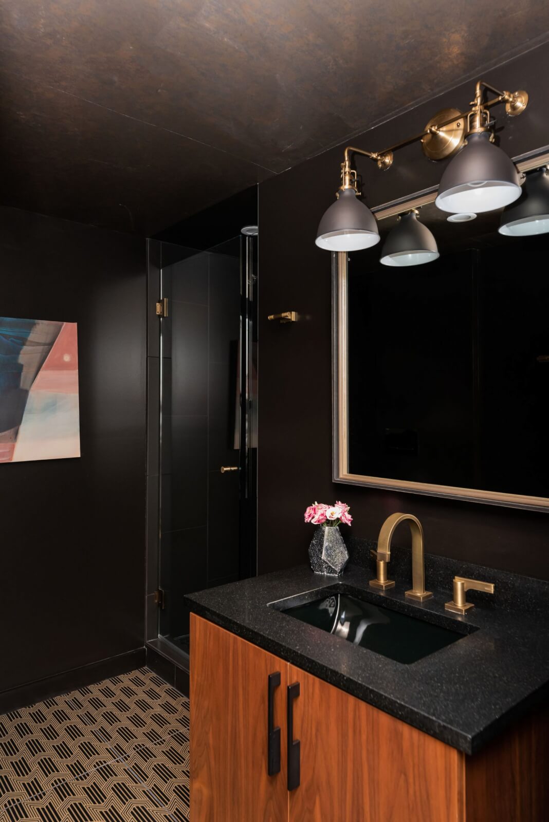 Dark, moody guest bathroom with black walls