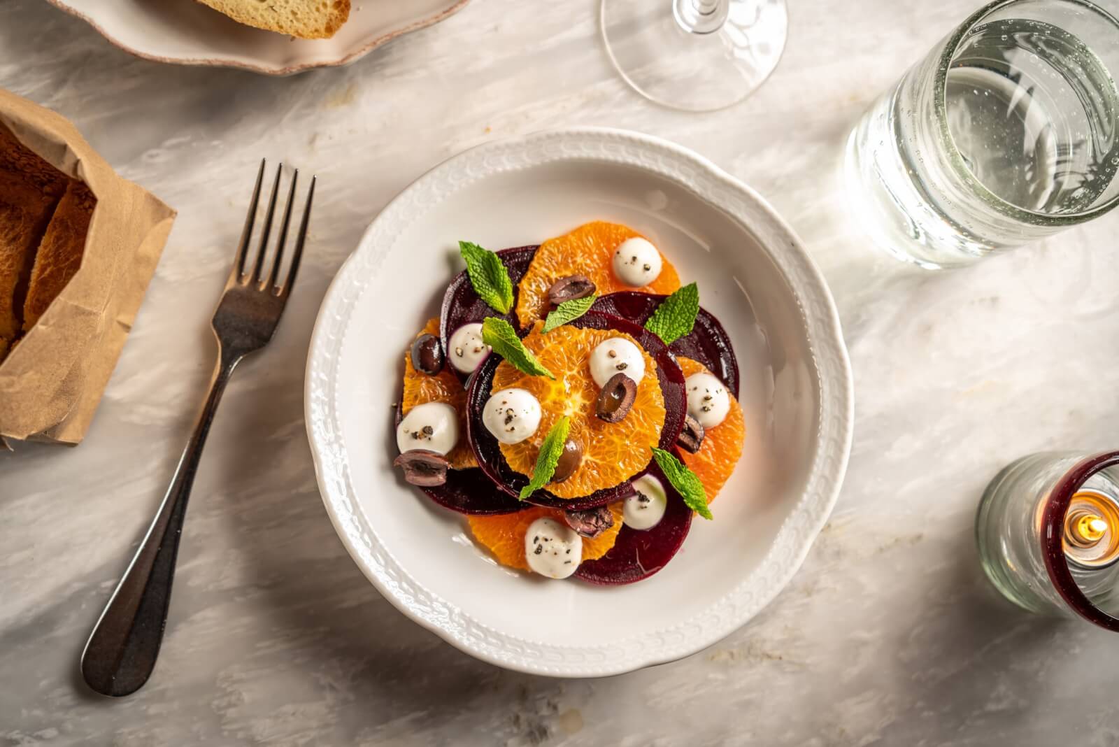 A beet and orange salad from The Dutch, featuring mint, olives, and cheese.