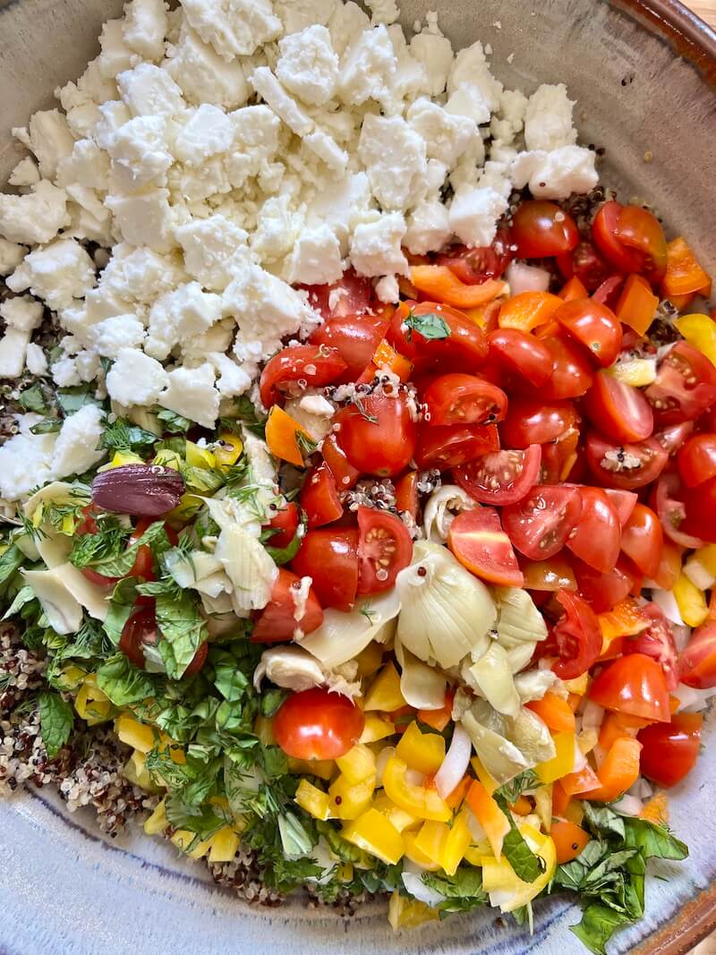 veggies and cheese on top of quinoa