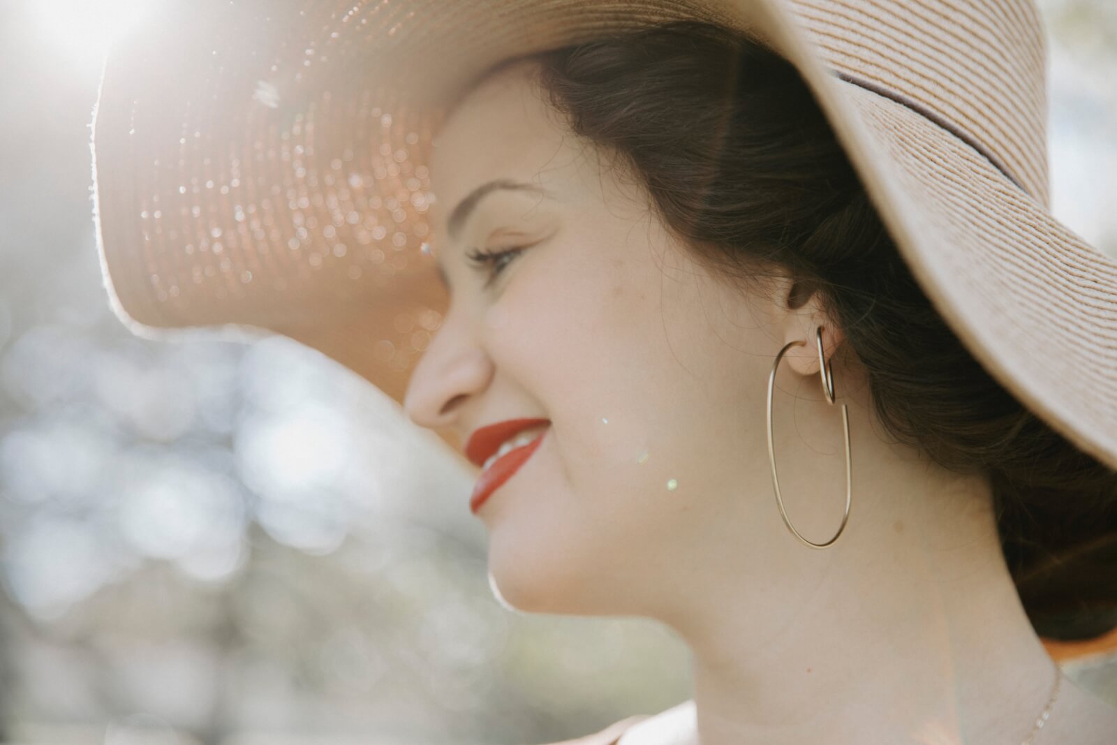 Woman modeling Oblong Hoops stacked from Lauren Brook Jewelry