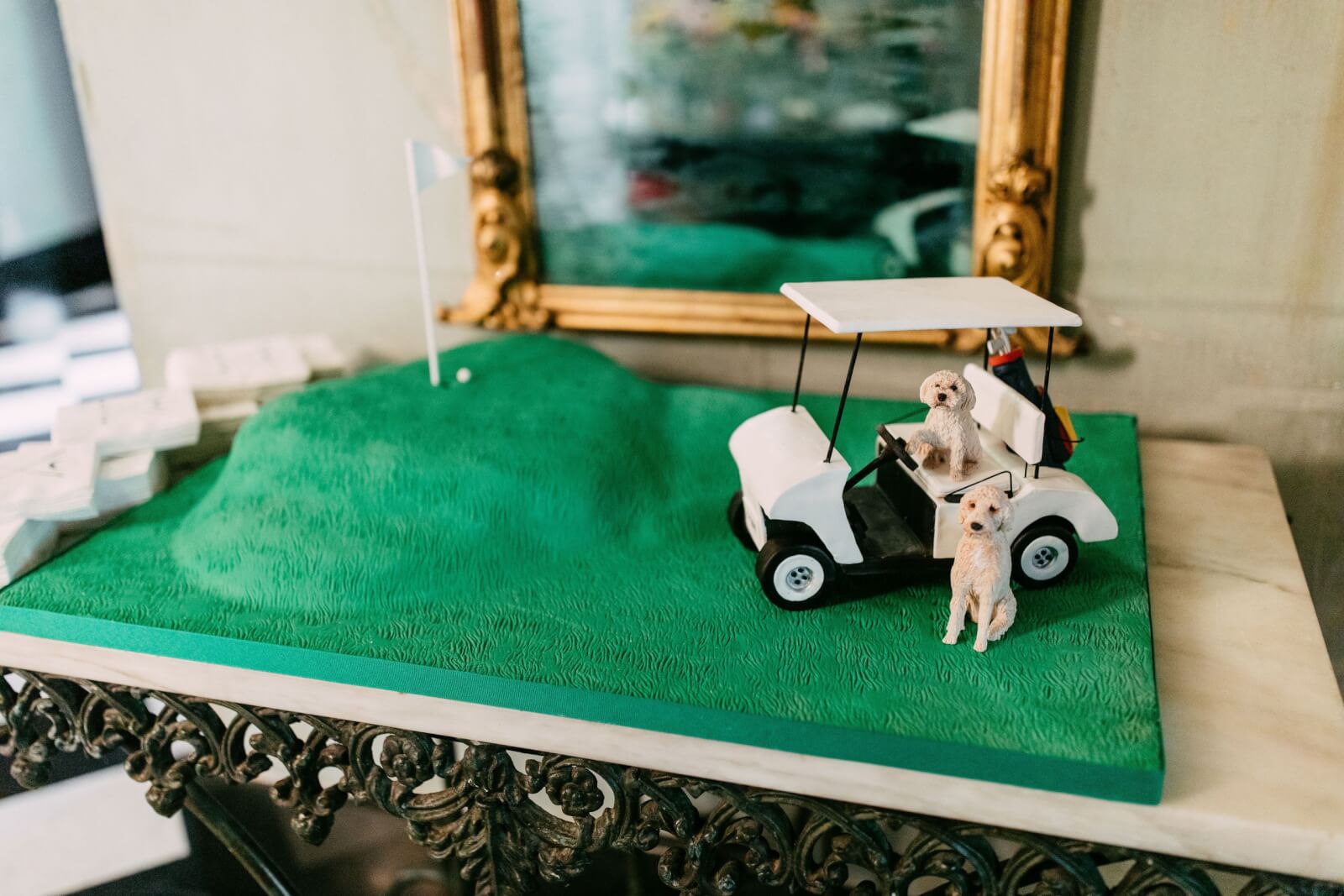 Groom's cake with golf cart and two goldendoodles