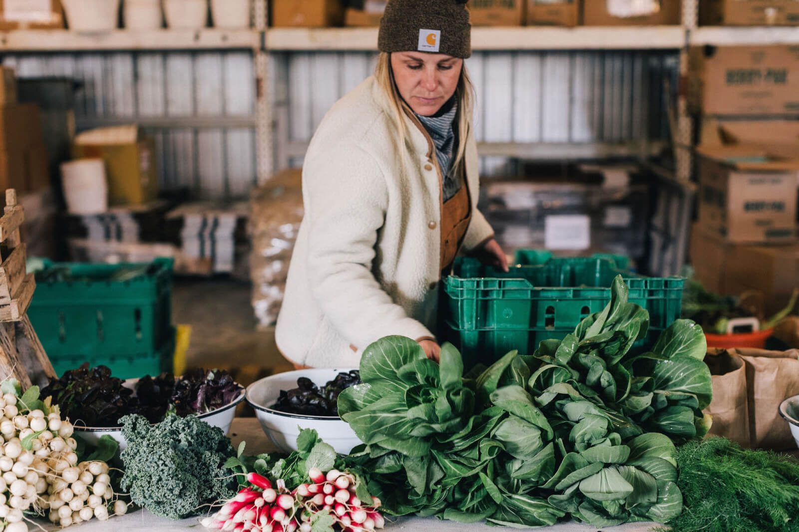 Lauren Palmer sorting Bloomsbury Farm vegetables such as radishes.