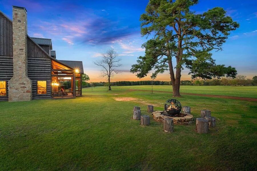Fire pit and cabin at sunset on Texas Ranch