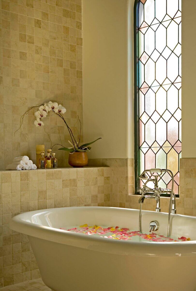 A luxury bathtub inside a hotel room.