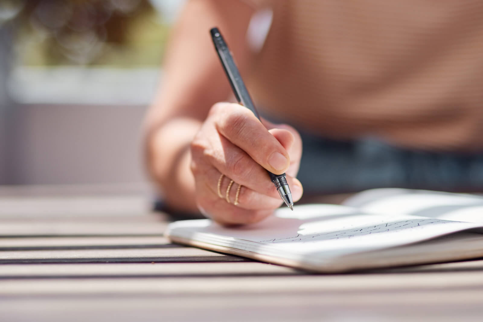 senior woman writing in journal