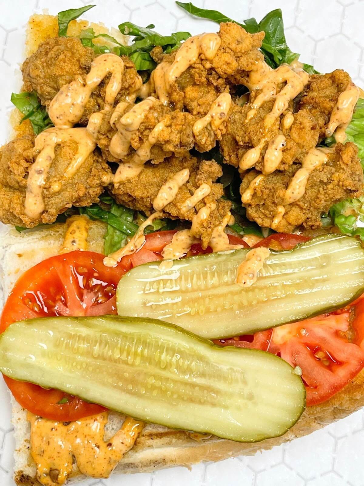 Plate of fresh seafood, tomatoes, and pickles from Image: Snapper Grabbers Land & Sea