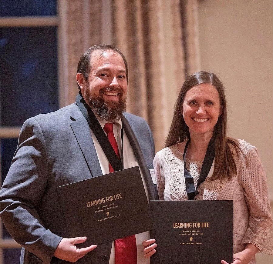 Jenny Waltman and her husband posing at Learning for Life award ceremony
