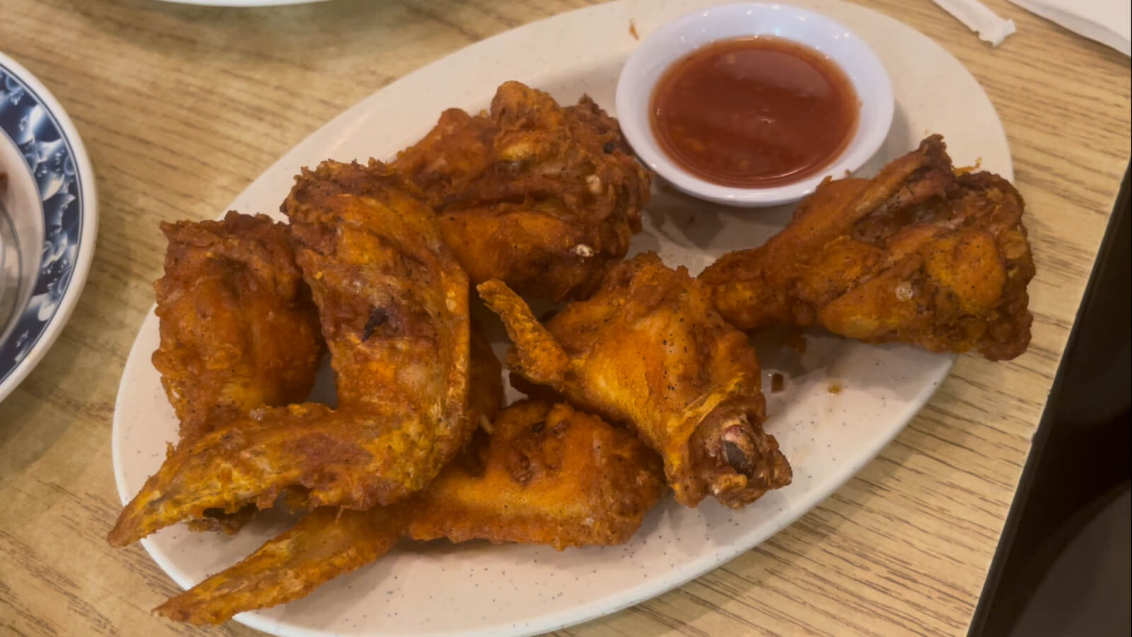 Fried Chicken Wings with a side of sweet, sticky chili sauce from King Market