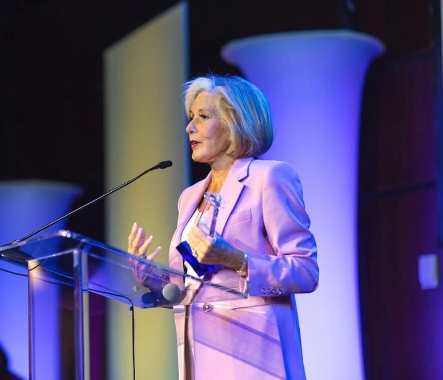 Cordia Harrington speaking at a conference.
