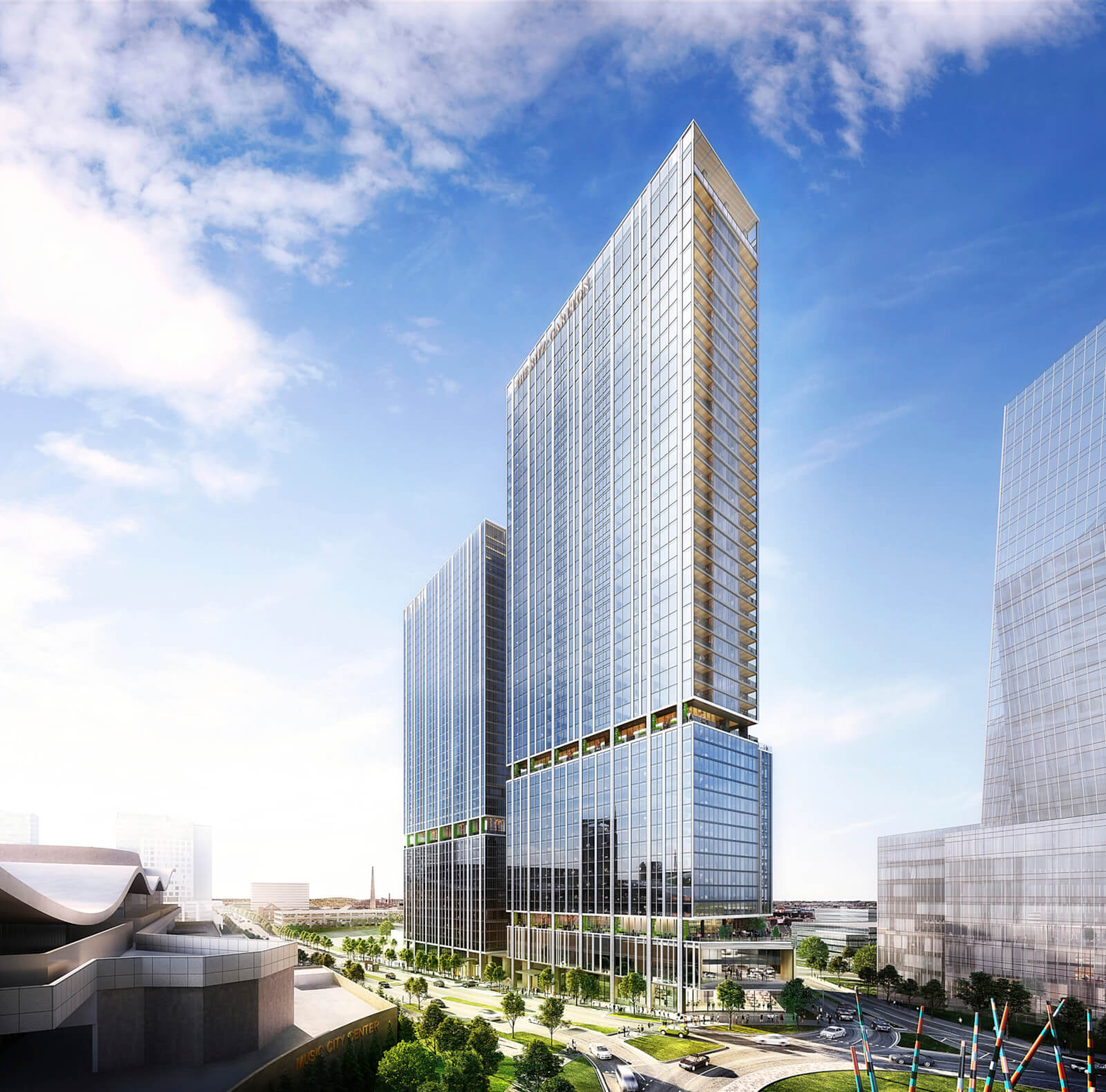The future Ritz-Carlton Nashville against a blue sky.