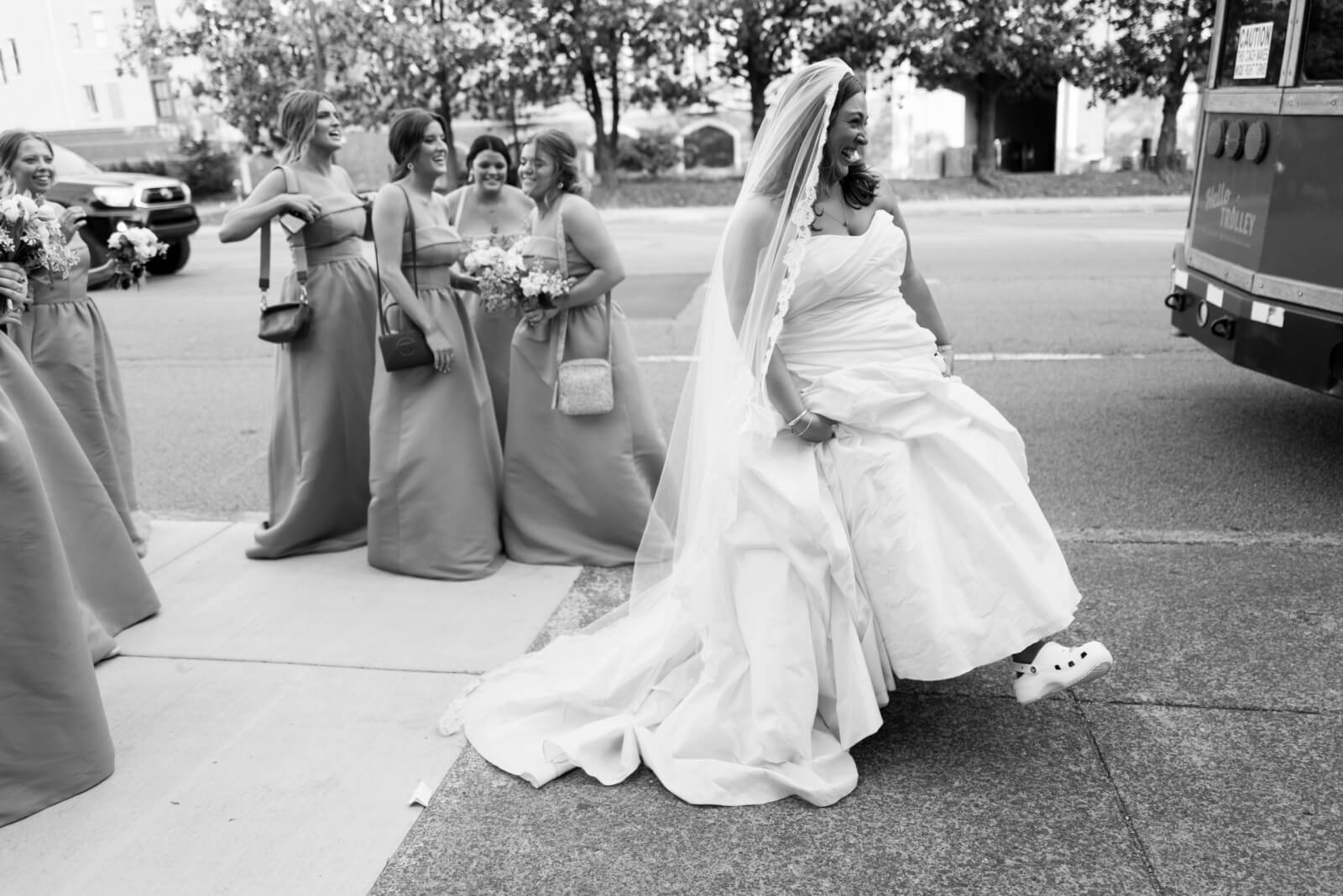 The bride and bridal party get ready to board the trolley.