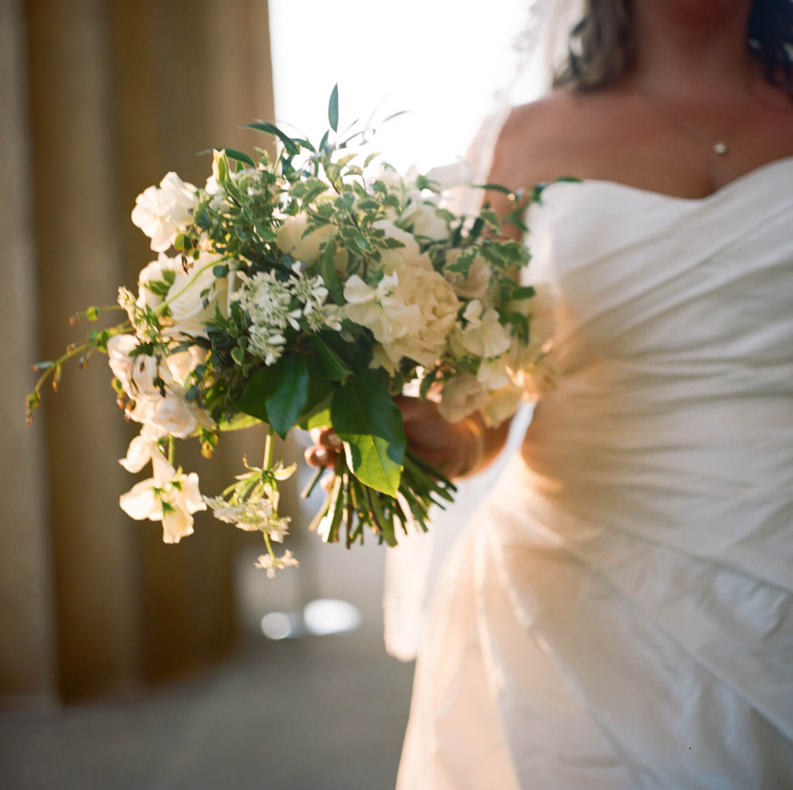 The Bridal bouquet shines in the sunlight.