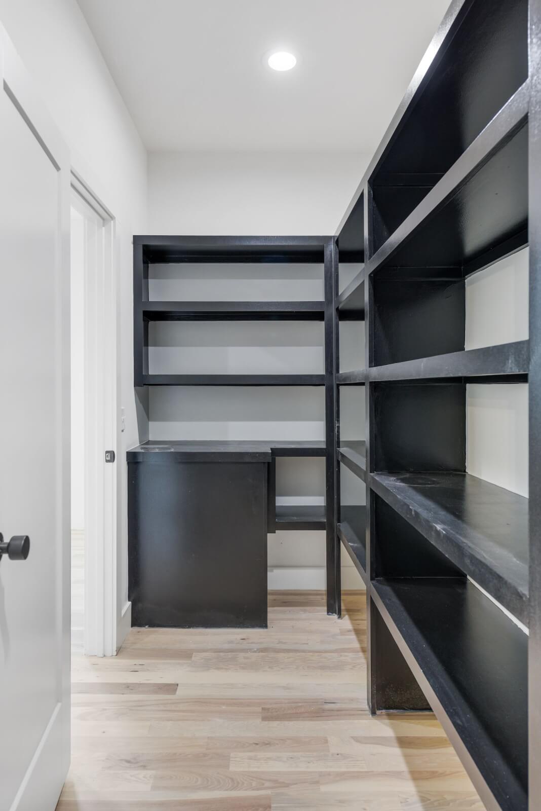 Walk-in pantry with black shelving at 11B Garden Street in Nashville, TN