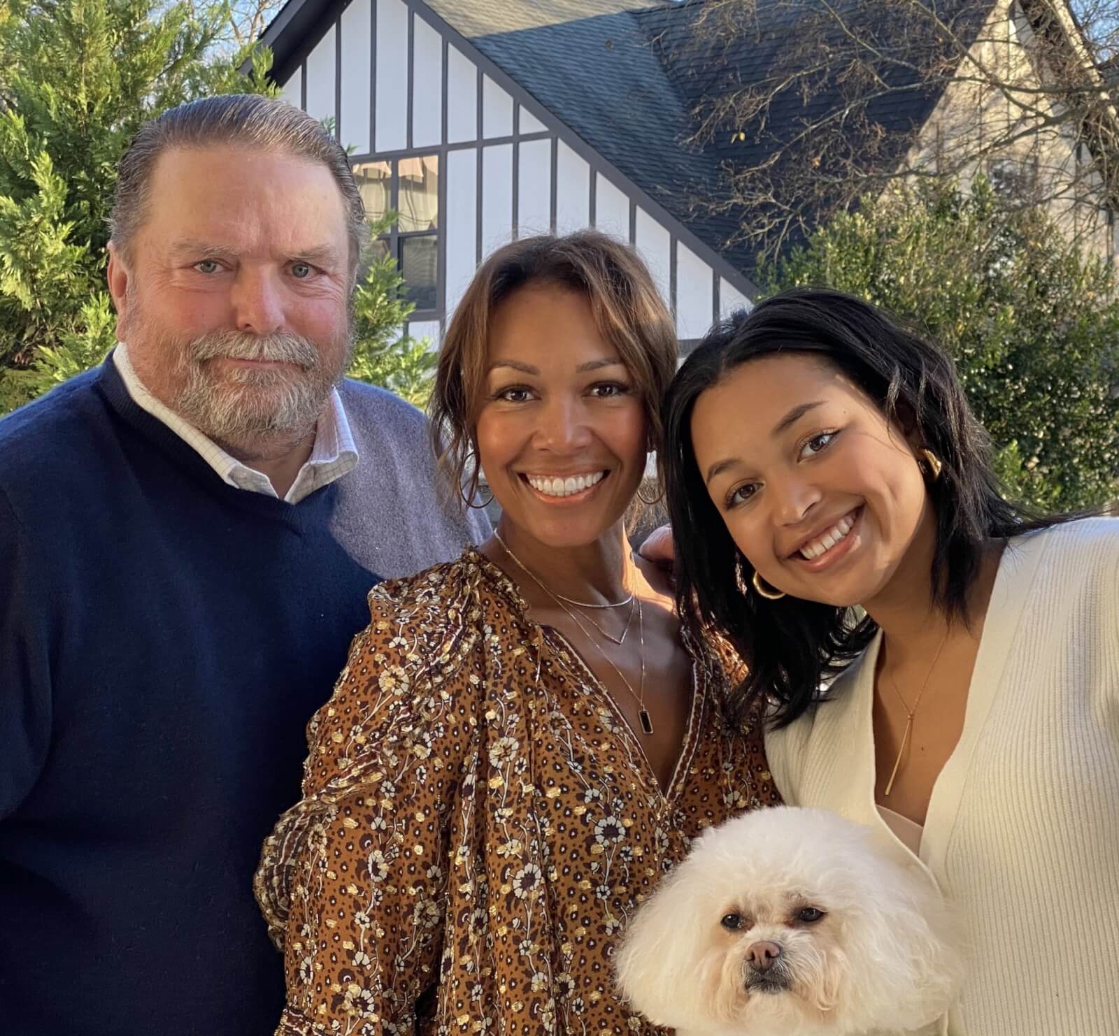 Kimberly Lewis with her husband Jim, daughter Lauren, and dog Bruno.