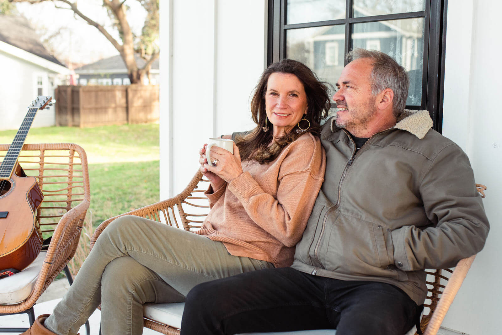 Becca Stevens and her husband, Marcus, sitting on the porch.