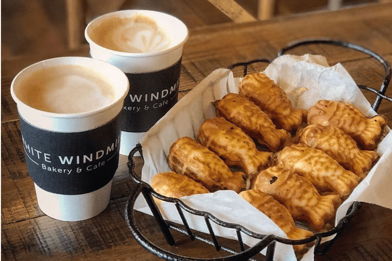 Coffee and a basket of fish-shaped Korean pastries.